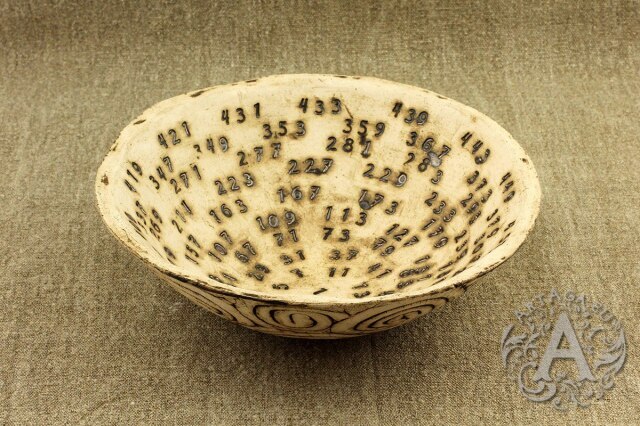 ceramic bowl with consecutive prime numbers imprinted inside