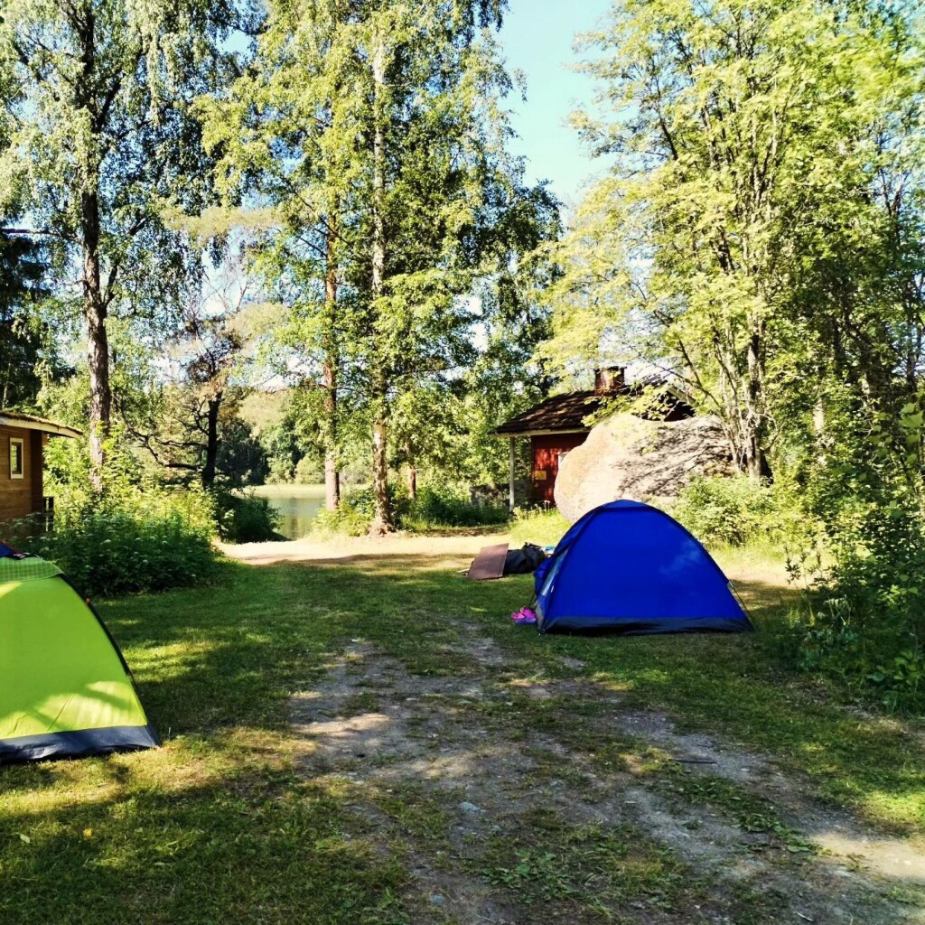 a photo posted to Facebook, tagging the campground, on June 28, 2024, showing both the brown cabin, rock and chimney.