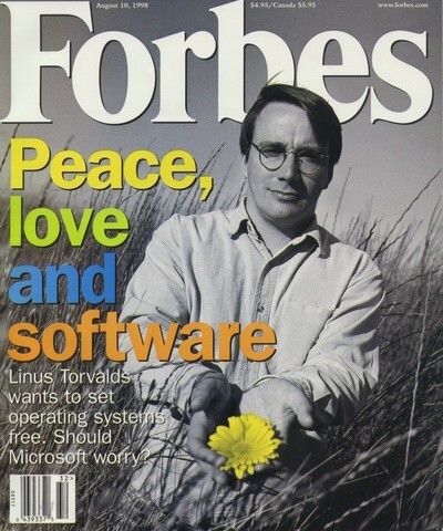 Forbes Magazine cover from August 10th, 1998, showing Linus Torvalds, the creator of the Linux kernel, holding a bright yellow flower in his hands. 