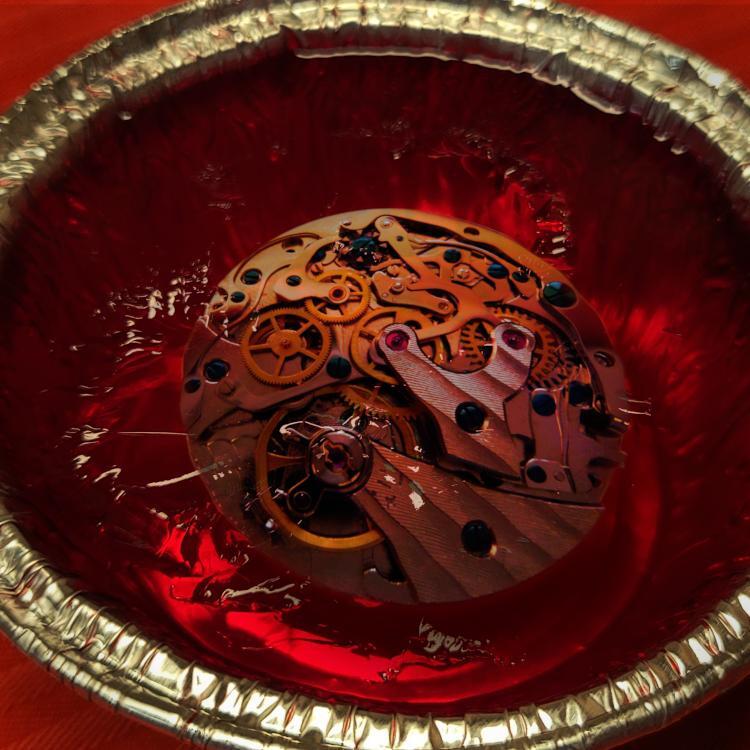 Image:
Martell (modified)
https://commons.wikimedia.org/wiki/File:Chronograph_movement.jpg

CC BY-SA 3.0
https://creativecommons.org/licenses/by-sa/3.0/deed.en

--

Horacio Cambeiro (modified)
https://commons.wikimedia.org/wiki/File:Gelatina_de_frutilla_(postre).jpg

CC BY-SA 4.0
https://creativecommons.org/licenses/by-sa/4.0/deed.en



