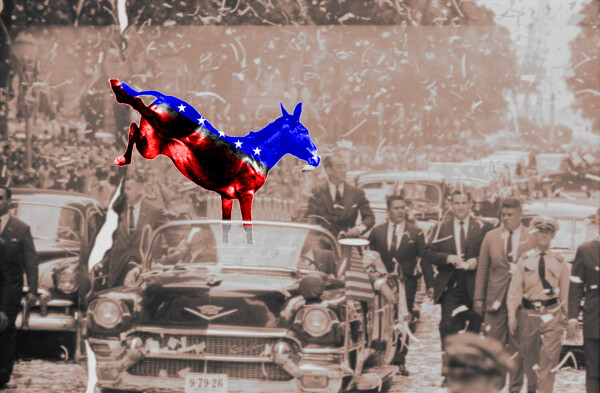 An old fashioned tickertape parade. In an open-top convertible, surrounded by security, is a kicking Democratic Party donkey colored red, white and blue.