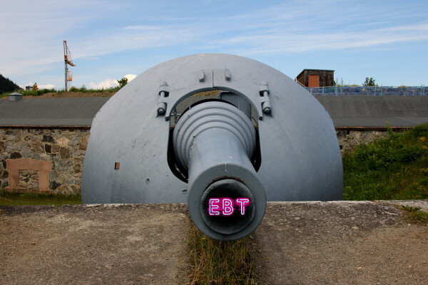 A down-the-barrel view of a massive, battleship-gray artillery piece protruding from the brick battlement of a fortress. From the black depths of the barrel shines a red neon 'EBT' sign.


Image:
Bjarne Henning Kvaale (modified)
https://commons.wikimedia.org/wiki/File:Oscarsborg_28cm_Krupp_cannon_4_-_panoramio.jpg

CC BY-SA 3.0
https://creativecommons.org/licenses/by-sa/3.0/deed.en
