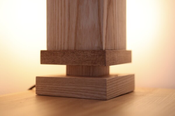 A closeup of the wooden table lamp