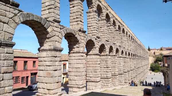 By the time the bottom level of this series of arches, built by the Romans over 2000 years ago, reaches the plaza in the distance, they dwarf the three story blocks of flats.