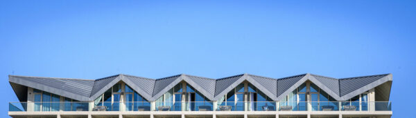 Roof of a building against a blue sky